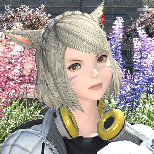 Miqo'te woman with short silver hair with her head tilted to the left, wearing a puffy white jacket with headphones around her neck.